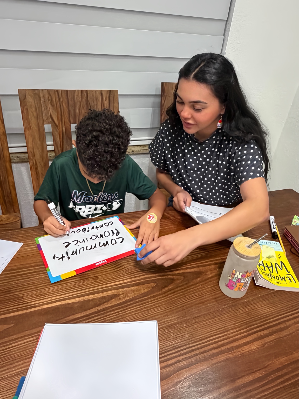 Ms. Liu working closely with a student during tutoring